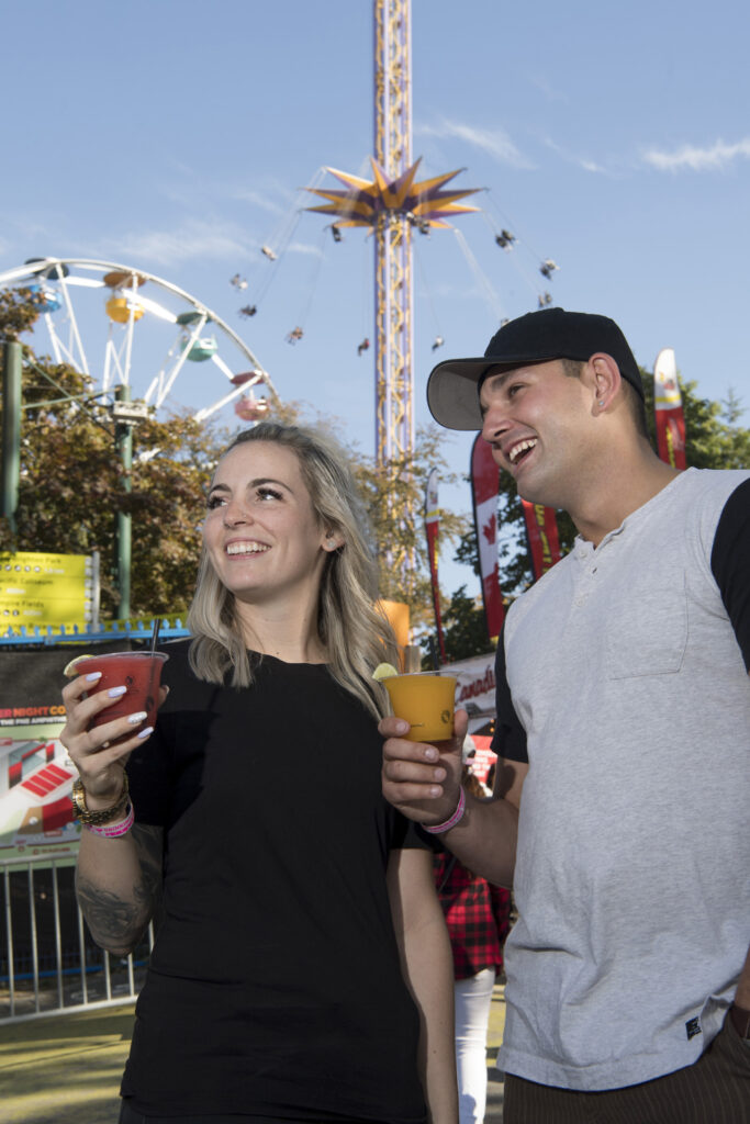 couple smiling at playland